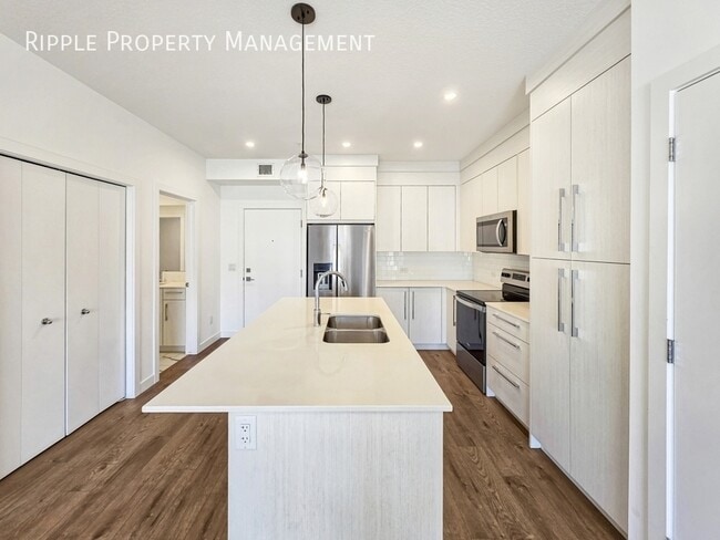 Building Photo - MODERN & SPACIOUS 2 BEDS, 2 BATHS CONDO UNIT | UNDERGROUND PARKING & PET SPA IN SAVANNA II