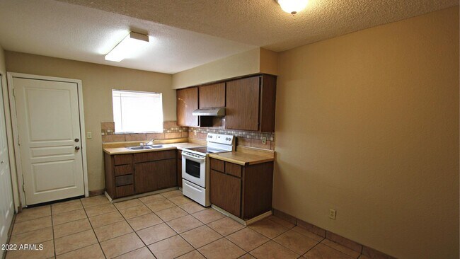 Building Photo - 6440 E Alder Ave