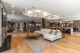 This 1320 square foot apartment, located at 1280 Harrison St in Seattle, showcases a contemporary design that maximizes space and functionality. The open-concept layout seamlessly integrates living, dining, and kitchen areas, creating a fluid and spacious atmosphere. The gourmet kitchen boasts sleek cabinetry, stainless steel appliances, and a large island with bar seating, perfect for casual dining and entertaining.

The living area features a modern fireplace, adding warmth and ambiance to the space. Floor-to-ceiling windows flood the apartment with natural light and offer stunning views of the Seattle cityscape. Light hardwood floors run throughout, complementing the neutral color palette and enhancing the overall sense of openness.

Communal spaces are equally impressive, with a stylish lounge area featuring exposed brick walls, comfortable seating, and a large screen for entertainment. Additional amenities may include a games room with a pool table and ample seating for socializing.

The apartment's thoughtful design extends to its entryway, which provides a welcoming transition from public to private spaces. With its blend of luxury finishes, modern amenities, and prime urban location, this apartment offers a sophisticated living experience in the heart of Seattle.