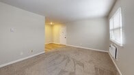 This 650 square foot apartment in Downingtown, PA offers a cozy living space with modern amenities. The single-story layout comprises two bedrooms, one bathroom, a living room, and a closet. The primary bedroom, measuring 140 square feet, provides a comfortable retreat.

Throughout the apartment, neutral-toned walls and plush carpeting create a warm, inviting atmosphere. Large windows in each room allow for abundant natural light, while window treatments offer privacy when needed. The living area features a combination of carpeted and hardwood flooring, adding visual interest and practicality to the space.

The bathroom showcases a clean, white design with built-in storage solutions. Climate control is maintained through a combination of baseboard heating and a window-mounted air conditioning unit, ensuring year-round comfort.

Storage is addressed with closet space and built-in shelving units. The apartment's compact size is maximized through an efficient floor plan, making it an ideal choice for small families, young professionals, or those looking to downsize.

Located at 238 Chestnut St in Downingtown, this property offers a blend of modern convenience and cozy living spaces, all within a manageable 650 square feet.