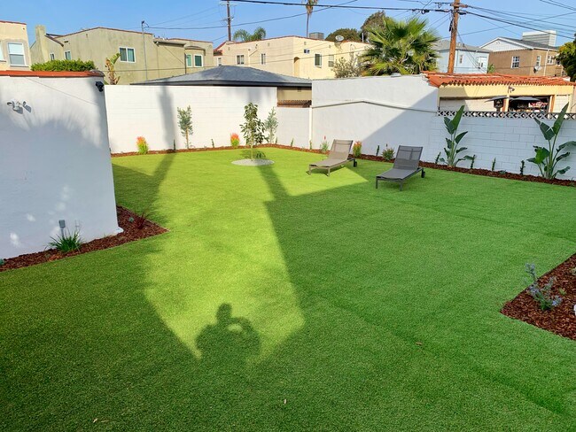 Lush, green backyard that was just completed. - 1143 S Cloverdale Ave