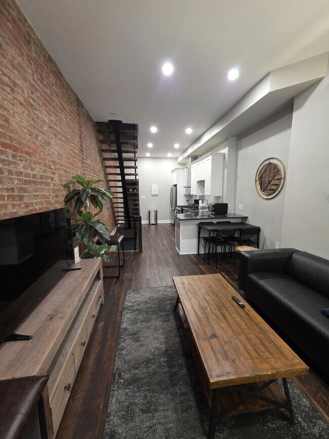Building Photo - Chic Urban Living: Furnished 2-Bed Townhouse with Finished Basement in Pittsburgh's Strip District!