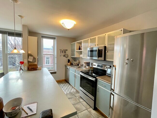 Kitchen with stainless steel appliances and all your essentials - 230 College St
