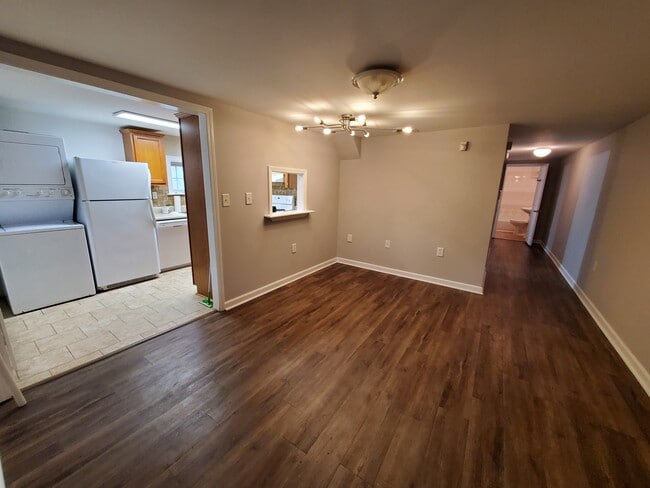 Large living area with kitchen pass- throuand entrance to kitchen w/ eating areahallway to bathroom - 512 Macon Hwy