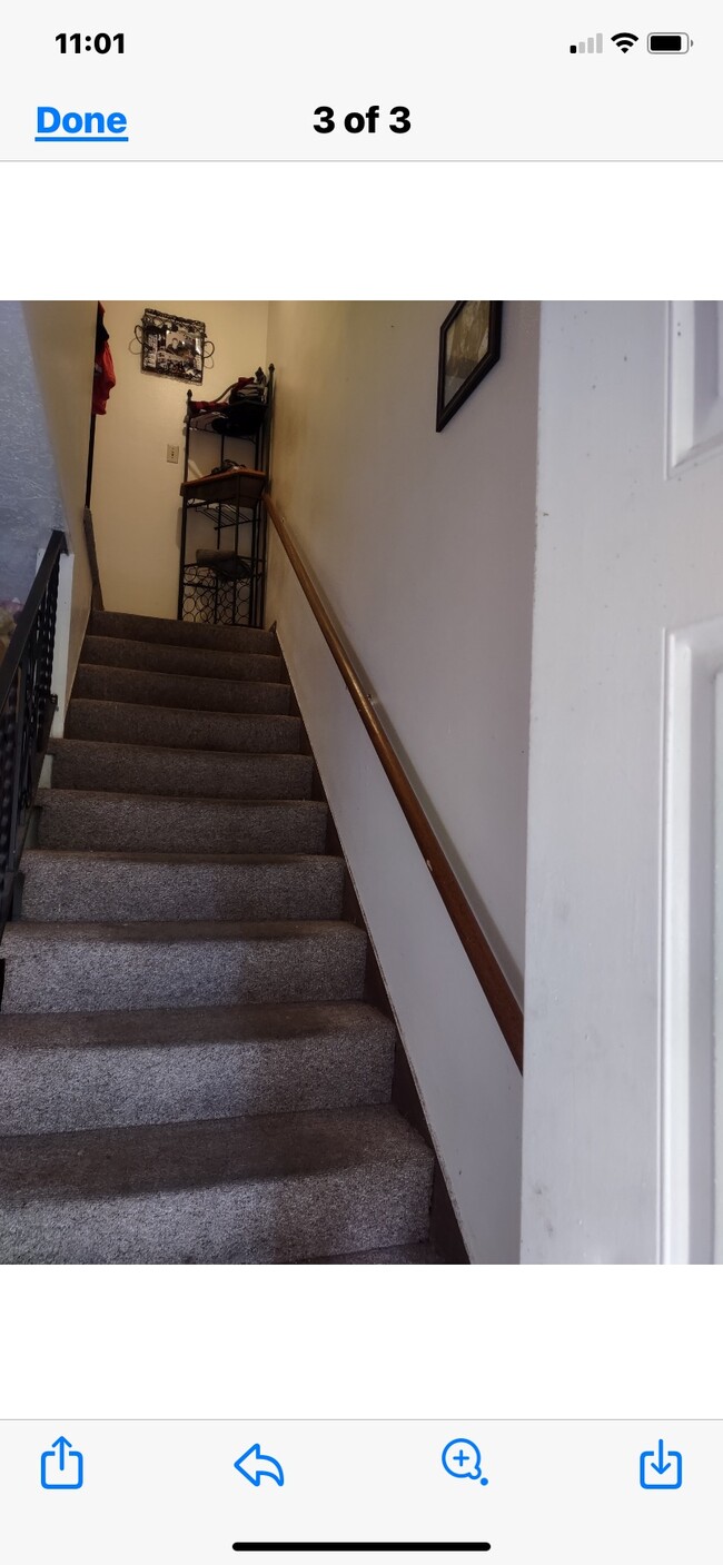 Stairs to two bedrooms and bathroom. - 1058 N 250 W