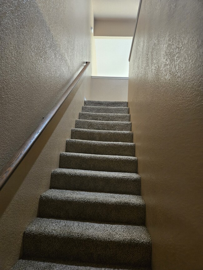 Stairs to the 3 bedrooms and 2 full bathrooms - 401 Ravenwood Way