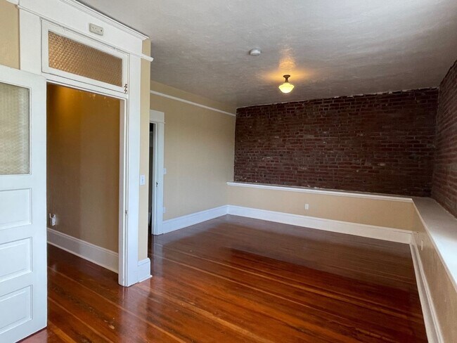 Building Photo - Urban DREAM! Spacious 1-Bedroom w/ Exposed Brick, Fireplace, & More in a Hip Location!