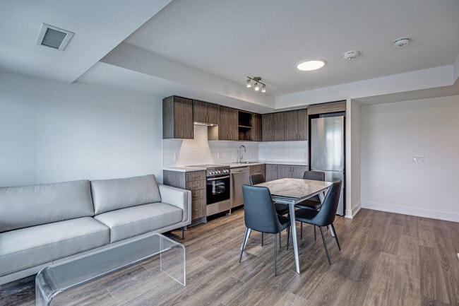 Building Photo - One Plus Den Furnished unit