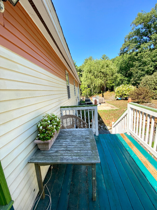 Apartment's private deck/ balcony and rear entrance - 9 Village Way