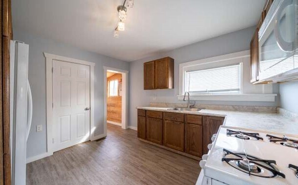Kitchen toward back entrance - 430 N Maple St