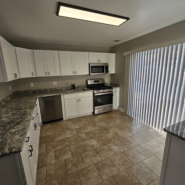 Building Photo - 3 Bedroom Ranch Completely Renovated - New Flooring, Doors and Fixtures, New Bathroom, New Kitche...