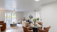 Located at 4711 S Himes Ave in Tampa, FL, this thoughtfully designed one-bedroom, one-bathroom home offers a comfortable and efficient single-floor layout. Light-toned luxury vinyl plank flooring runs throughout, lending a cohesive, modern aesthetic to every room.

The open-concept living and dining area forms the heart of the home, bathed in natural light from a sliding glass door that leads to a view of lush greenery. A ceiling fan keeps the space comfortable year-round. The dining area is a well-defined space, accented by a stylish arched mirror and a pass-through view into the kitchen, making it ideal for both everyday meals and entertaining.

The galley-style kitchen is efficiently organized with white shaker cabinetry, light quartz countertops, a stainless steel sink, and a full suite of appliances including a refrigerator, range, and dishwasher.

The bedroom is a serene retreat, benefiting from a large window that filters in natural light and a ceiling fan overhead. It includes direct access to a walk-in closet with built-in wire shelving, providing generous storage. The full bathroom features a tub-shower combination and a quartz-topped vanity, finished in a clean, neutral palette.

The overall ambiance is bright, modern, and welcoming — a well-appointed home in the heart of South Tampa.
