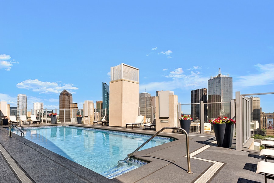 Rooftop saltwater pool with Downtown Dallas views - SkyHouse Dallas Apartments
