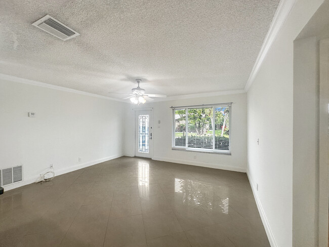 Spacious bright living room welcomes you home daily - 6001 NW 71st Ave