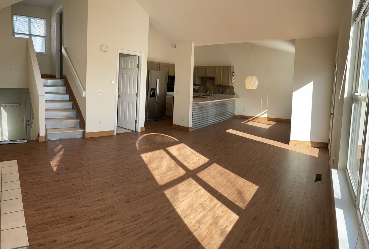 Main floor great room - NEW FLOORS - sunny with tall ceilings and amazing mountain views - 535 Canyon View Drive