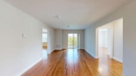 Located at 333 River Dr in Allentown, PA, this single-floor, 3-bedroom, 2-bathroom home offers a well-designed layout that balances comfort and functionality. Warm hardwood flooring flows consistently throughout the entire residence, lending a cohesive and inviting aesthetic to every room.

The living room serves as the heart of the home, filled with natural light from large windows and a sliding glass door that opens directly onto a private balcony, providing pleasant outdoor views and easy access to fresh air. The hallways connecting the rooms are well-proportioned, contributing to a smooth and logical flow throughout the space.

The kitchen is thoughtfully equipped with rich, raised-panel cabinetry, granite countertops, a stainless steel sink, and black appliances including a range and built-in microwave — offering both style and practicality for everyday cooking.

The three bedrooms are comfortably sized, with the primary bedroom offering a generous footprint. Bedrooms feature hardwood floors, ample natural light, and closet storage, including a full-panel bi-fold closet in one of the secondary rooms.

The two bathrooms are clean and functional, with one featuring tile accents and a full tub-shower combination. Neutral wall tones throughout the home create a bright, move-in ready environment suitable for a variety of living arrangements.