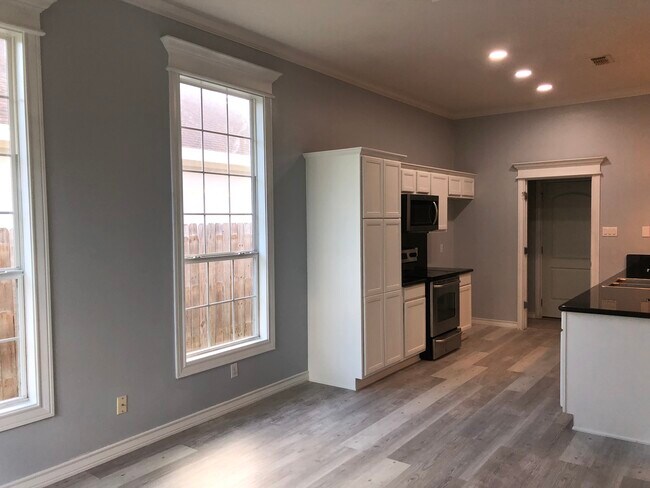 New vinyl floor and interior paint throughout. - 708 S Excalibur St