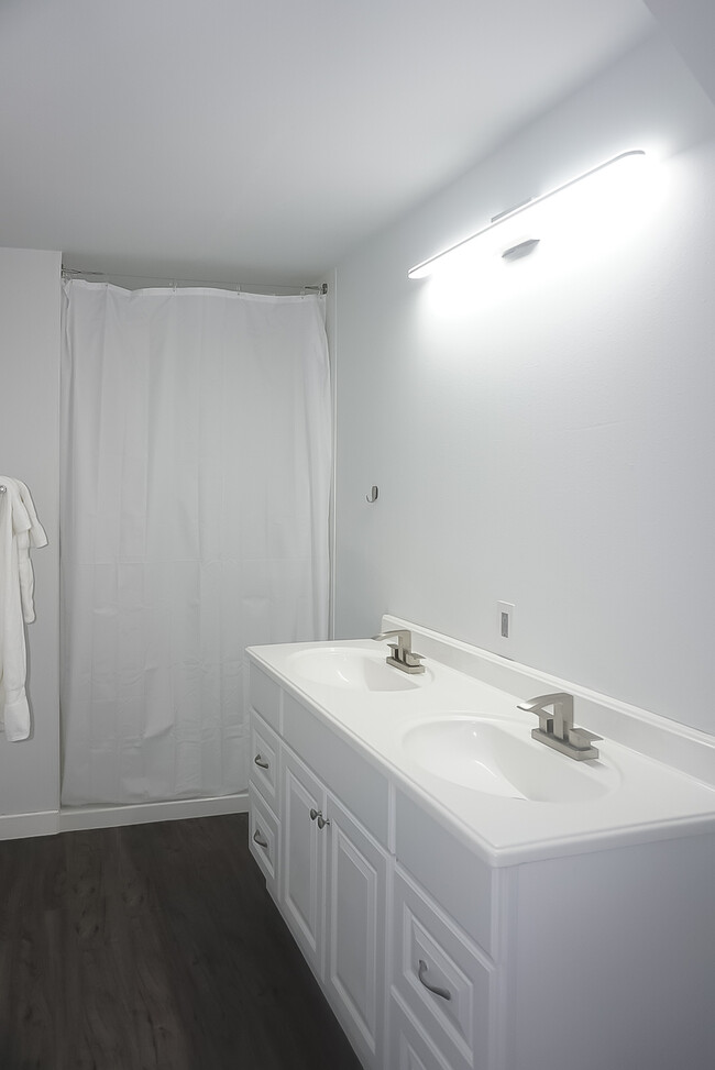 Three bathrooms with showers are shared between five rooms. - 8801 Aurora Ave N