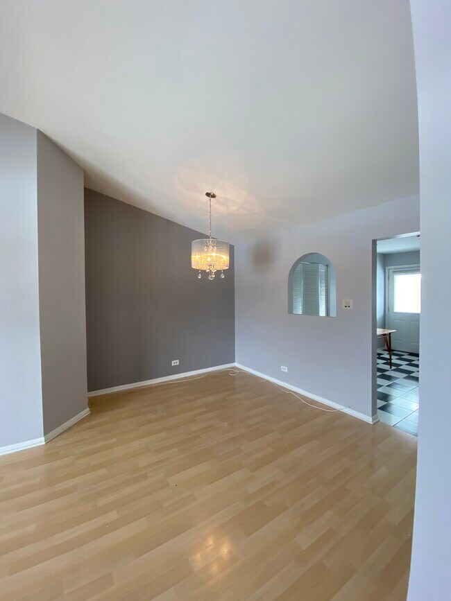 Dining area with dimmable chandelier - 152 E Winchester Rd