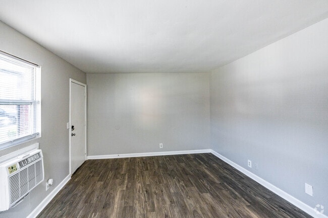 2BR, 1BA - 750SF - Living Room - Village on the Green