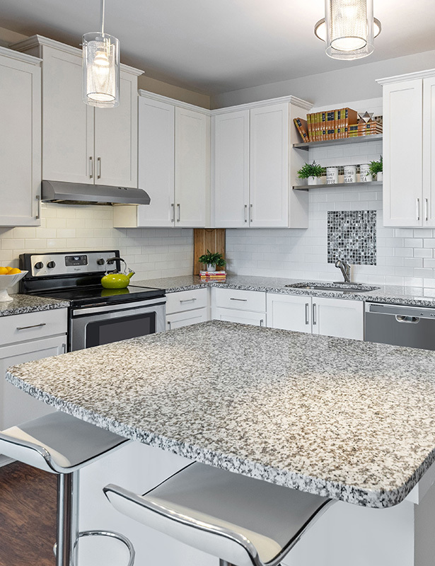 Stainless steel appliances and granite countertops - Artisan Station Apartments