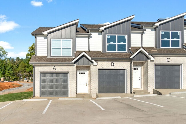 Building Photo - 301 Longshadow Trail - Model Townhome