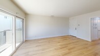 This 620 square foot apartment in San Clemente, California, offers a perfect blend of compact living and modern amenities. The single-floor layout comprises one bedroom, one bathroom, a combined kitchen and living room, and a hallway, creating an efficient use of space.

The kitchen is a standout feature, boasting sleek white cabinetry, stainless steel appliances, and a gas range. A large window above the sink allows natural light to flood the space, while providing views of the surrounding area. The adjacent living room is open and airy, with hardwood flooring that extends throughout the apartment, creating a seamless flow between spaces.

The bedroom, measuring 170 square feet, is generously sized for the apartment's overall footprint. It features a large window and a ceiling fan, ensuring comfort and ample natural light. The bathroom is modern and well-appointed, with a glass-enclosed shower, marble-like countertops, and contemporary fixtures.

One of the apartment's highlights is the balcony, accessible from the living area, which offers an outdoor extension of the living space and potentially scenic views. The property's location at 811 Buena Vista in San Clemente puts residents in proximity to coastal amenities and the charm of this Southern California beach town.

Overall, this apartment combines efficient design, modern finishes, and a prime location to create an appealing living space in a desirable coastal setting.