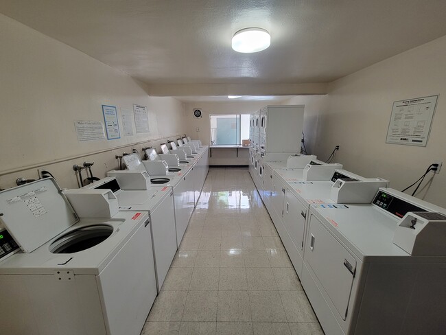 LAUNDRY ROOM - The Palms Apartments