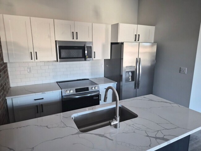 Building Photo - Downtown Claremont newly re-developed brick building with 2 Bed Luxury units, pet friendly!