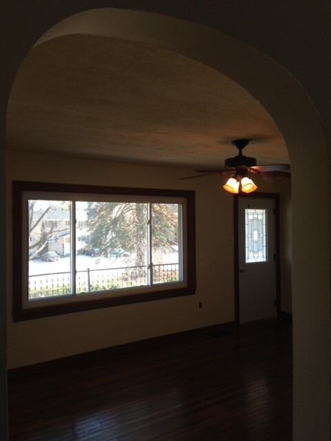 Living room looking at front door and covered porch - 1409 N Woodburn Ave