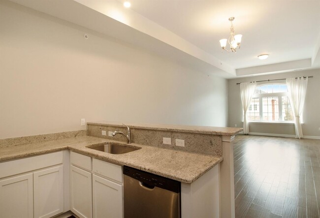 Kitchen to great room - 5653 Arbor Chase Dr