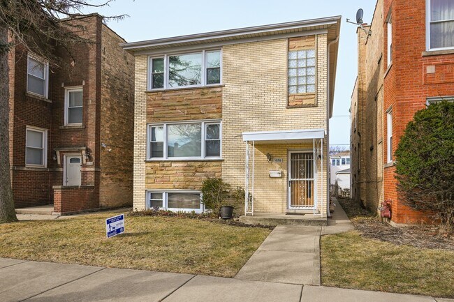 Foto del edificio - 5850 N Mulligan Ave