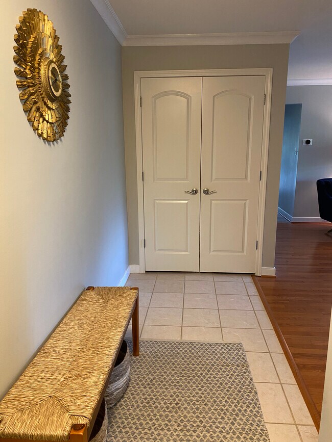 entry hallway with coat closet - 1227 Gemini Dr