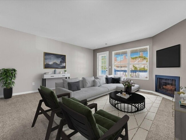 A cozy fireplace adds warmth and ambiance, while comfortable seating and contemporary décor create a relaxed yet upscale atmosphere. - Wyndham Hill