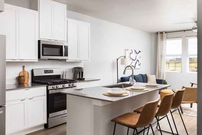 Elegant Spaces with Wood-Style Flooring on Main Floor - Finley at Baseline Townhomes
