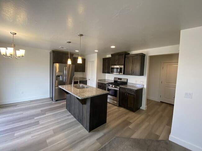 Building Photo - "Spacious 4-Bedroom Townhouse Retreat on S...