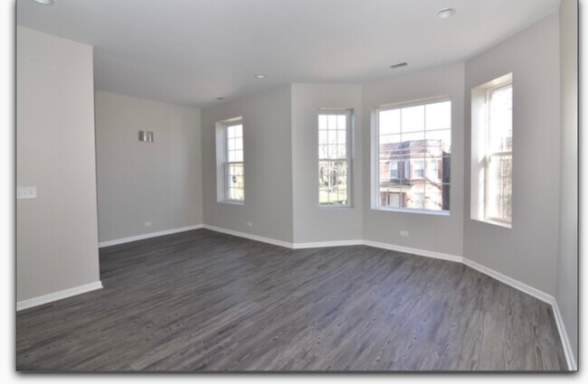 Large Living Room New Windows and Flooring - 6430 S Vernon Ave