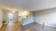 Located at 19950 Roscoe Blvd in the Winnetka neighborhood of Los Angeles, this single-floor unit offers a clean, updated interior with a cohesive neutral palette throughout. The open-concept living and dining area is anchored by warm wood-look vinyl flooring and soft gray walls, creating a bright and welcoming atmosphere. A ceiling fan adds both comfort and style to the living space.

The kitchen is defined by a peninsula-style counter that separates it from the main living area while maintaining an open feel. White cabinetry, light speckled countertops, a gas cooktop, wall oven, and a full-size refrigerator make up the functional kitchen layout, offering ample storage and counter space.

The bedroom is a well-proportioned, quiet retreat featuring the same wood-look flooring, soft gray walls, a textured ceiling, and a wide window fitted with vertical blinds that allow for adjustable natural light. An additional room with the same updated flooring and muted sage-toned walls provides flexible living space.

The bathroom is efficiently designed, featuring a full shower-tub combination, updated fixtures, and wood-look flooring that ties the space together. A small window above the tub allows for natural ventilation. The unit's consistent finishes and thoughtful layout make it a practical and comfortable living space in the heart of the San Fernando Valley.