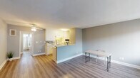 Located at 19950 Roscoe Blvd in the Winnetka neighborhood of Los Angeles, this single-floor unit offers a clean, updated interior with a cohesive neutral palette throughout. The open-concept living and dining area is anchored by warm wood-look vinyl flooring and soft gray walls, creating a bright and welcoming atmosphere. A ceiling fan adds both comfort and style to the living space.

The kitchen is defined by a peninsula-style counter that separates it from the main living area while maintaining an open feel. White cabinetry, light speckled countertops, a gas cooktop, wall oven, and a full-size refrigerator make up the functional kitchen layout, offering ample storage and counter space.

The bedroom is a well-proportioned, quiet retreat featuring the same wood-look flooring, soft gray walls, a textured ceiling, and a wide window fitted with vertical blinds that allow for adjustable natural light. An additional room with the same updated flooring and muted sage-toned walls provides flexible living space.

The bathroom is efficiently designed, featuring a full shower-tub combination, updated fixtures, and wood-look flooring that ties the space together. A small window above the tub allows for natural ventilation. The unit's consistent finishes and thoughtful layout make it a practical and comfortable living space in the heart of the San Fernando Valley.