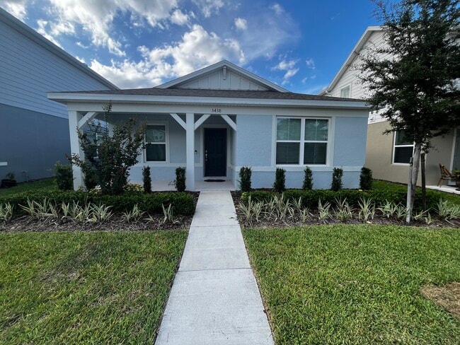 Front entrance and covered porch. - 3438 Orange Rose Loop House