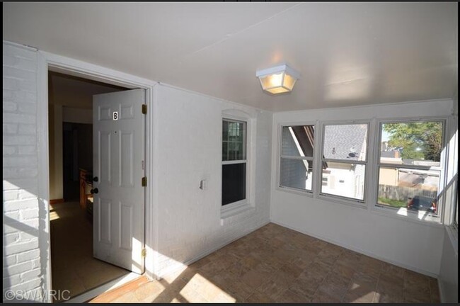 3 seasons porch at top of stairs - 2221 S Burdick St