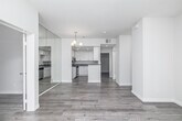 This contemporary 750 square foot apartment in Los Angeles boasts a thoughtful layout with two bedrooms and two bathrooms. The interior showcases a fresh, modern aesthetic with light-toned wood flooring throughout. The open-concept living area features a cozy fireplace and large sliding glass doors, allowing ample natural light and offering views of the surrounding area.

The kitchen is a highlight, with sleek white cabinetry, stainless steel appliances, and quartz countertops, creating a bright and efficient cooking space. Both bathrooms are tastefully designed with modern fixtures, including glass-enclosed showers and stylish tile work.

The bedrooms are generously sized, with the primary bedroom measuring 160 square feet. Each room is equipped with ample closet space and large windows for natural illumination. The apartment's neutral color palette and clean lines contribute to a sense of spaciousness and tranquility.

Additional features include recessed lighting, vertical blinds for privacy, and a well-organized floor plan that maximizes the use of space. Located at 8715 Burton Way, this apartment offers a perfect blend of style and functionality in the heart of Los Angeles.