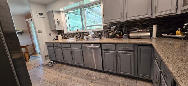 Photo - Spacious Ranch-Style 5BR Home w/ Finished Basement & Large Fenced Yard