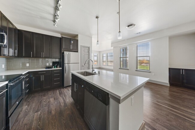 Newly renovated kitchens- featuring luxury quartz islands, custom cabinetry, and stainless steel appliances - Windsor at Pinehurst