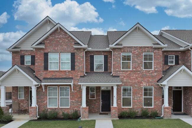 Building Photo - **BE THE LUCKY ONE TO LIVE IN THIS 2024-BUILT BRICK TOWNHOME IN THE VILLAS AT REGAL SQUARE FEATUR...