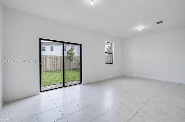 Building Photo - 3 br, 2.5 bath House - 23509 SW 129 path
