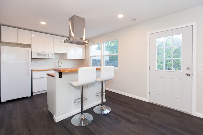 Modern space comes partially furnished with barstools - 4358 Aragon Dr