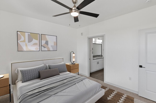 Retreat to a bedroom built for relaxation. - Lofts at Highlands