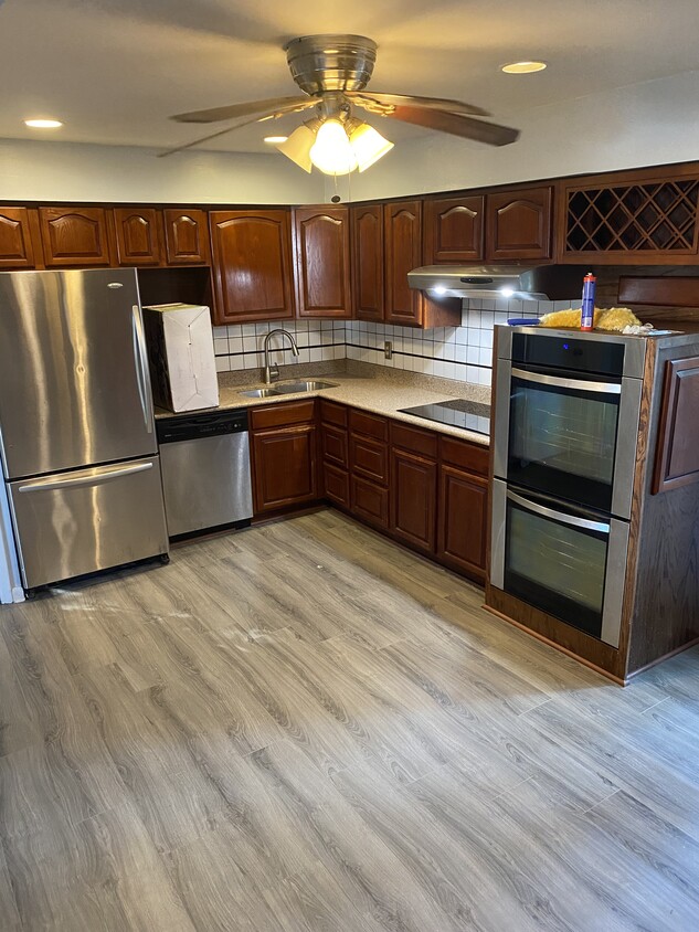 Modern kitchen with Electrolux double oven and induction cook top - 1011 Coastaway Dr