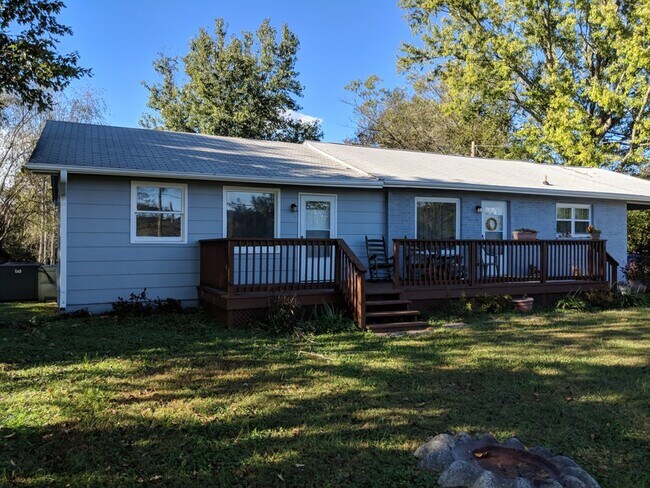 The home to the right with the covered parking area is currently available. - 7005 Washington Pike